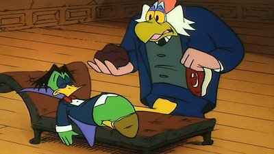 Count Duckula sleeping on a couch