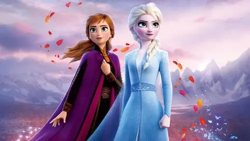 Anna and Elsa standing out side as fall leaves blow around