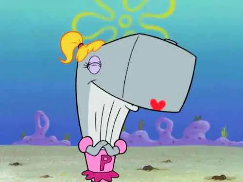 Pearl Krabs smiling with her arms crossed