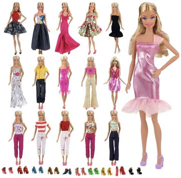 Barbie doll with several different outfits and shoes