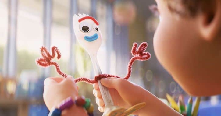 Bonnie holding up her new creation Forky from Toy Story 4