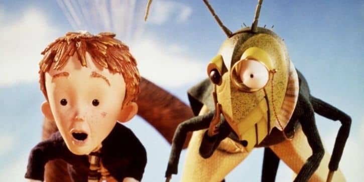 James and Grasshopper riding on the giant peach
