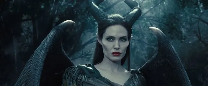 Maleficent posing with black wings and black horns