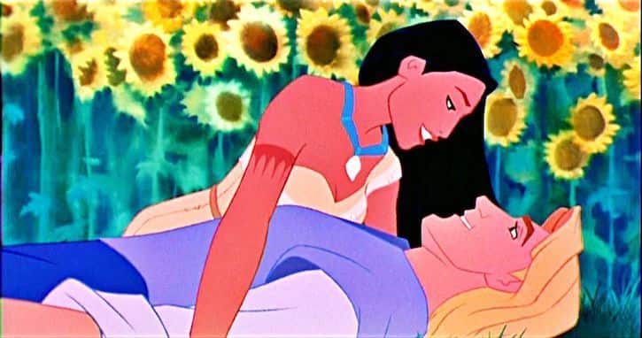 Pocahontas looking into John Smith's eyes as he lays on his back