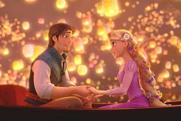 Prince Flynn Rider and Rapunzel sitting on a row boat holding hands during the lantern ceremony