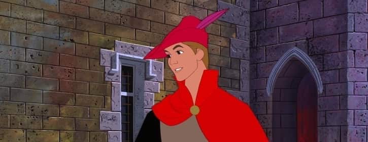Prince Phillip wearing a bland and brown suit, red cape, and red hat with purple feather