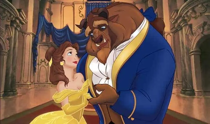 Princess Belle and The Beast dancing in her yellow ball gown