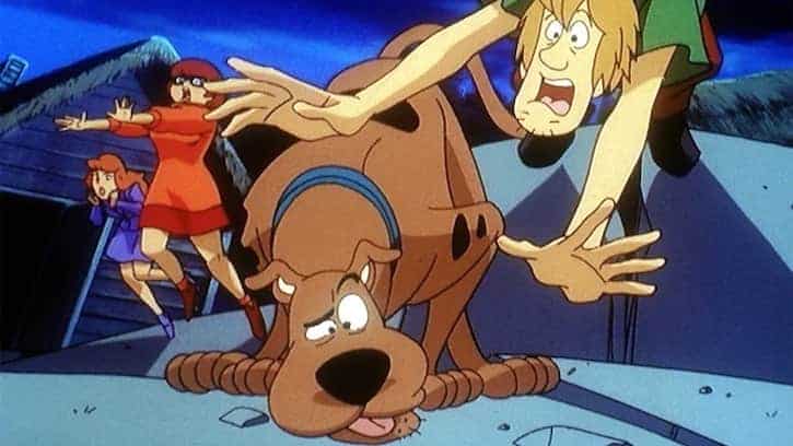 Scooby sniffing the ground and shaggy falling down