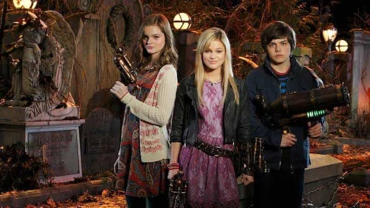 Skyler, Sadie, and Henry posing with monster guns