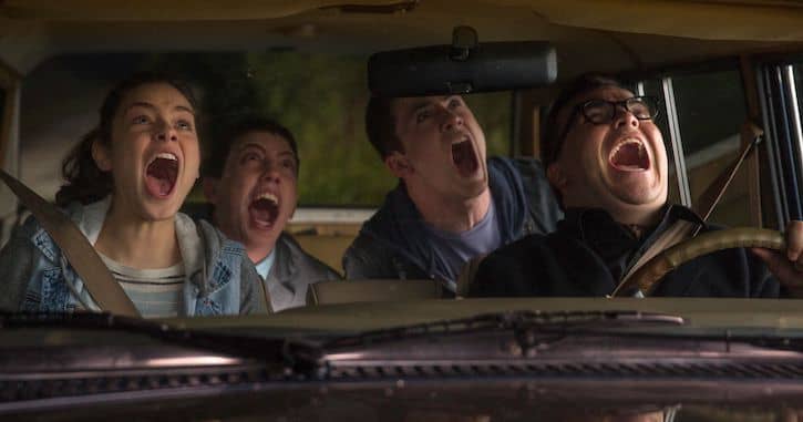 Stine, Zach, Hannah, and Champ screaming in a car