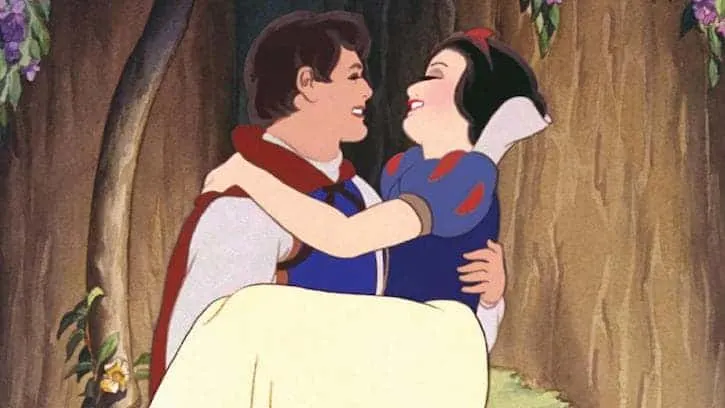 Snow White being carried by The Prince while looking into his eyes