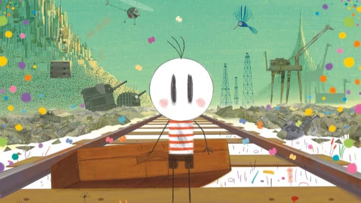 Cuca standing on a set of rail road tracks