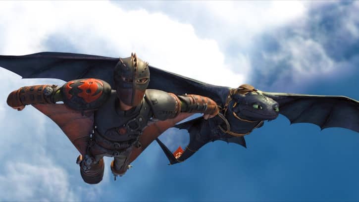 Hiccup flying along the side of Toothless in his wing suit