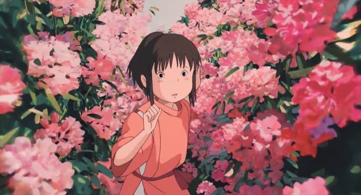 Spirited Away movie Chihiro Ogino surrounded by pink flowers