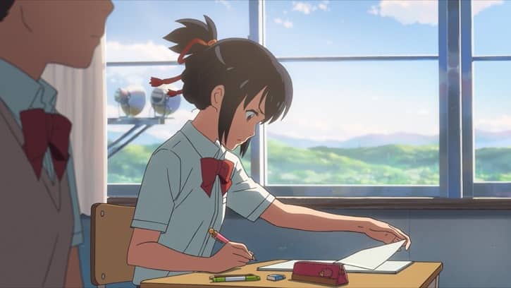 Your Name movie showing Mitsuha doing school work at a desk