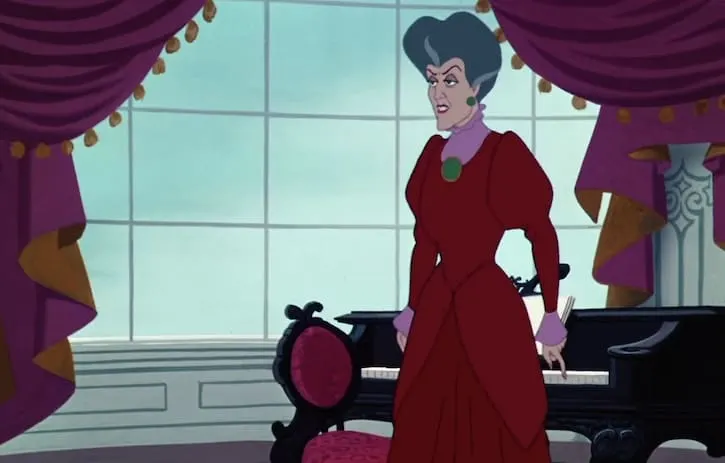 Lady Tremaine standing by a piano