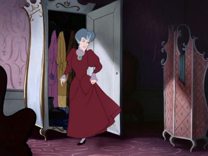 Lady Tremaine standing by her open wardrobe