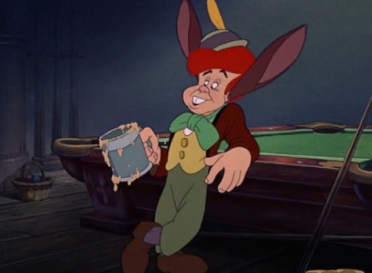 Lampwick turning with donkey ears leaning on a billiards table