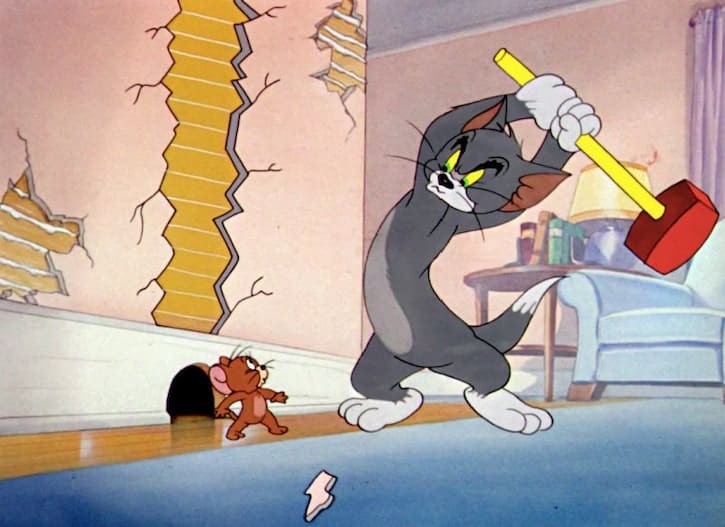 Tom chasing Jerry with a red sledge hammer