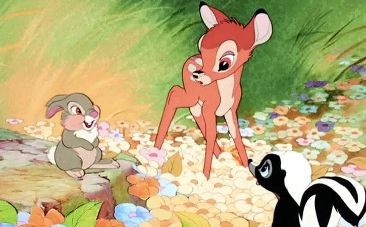 Bambi, Thumper, and the skunk he calls Flower at a flower patch