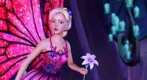 Barbie Mariposa flying while holding a flower