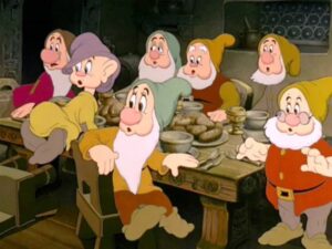 Dopey at the dinner table with the other dwarfs