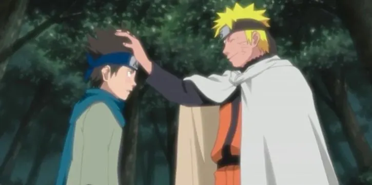 Naruto holding his hand up to Konohamaru Sarutobi's forehead