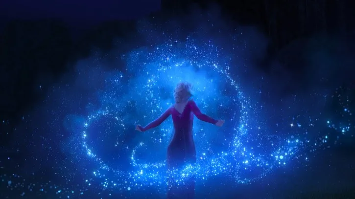 Elsa in a purple dress facing the darkness and waving her magical arms