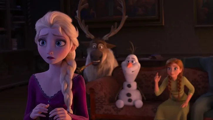 Elsa in a purple dress with Anna, Olaf, and Sven