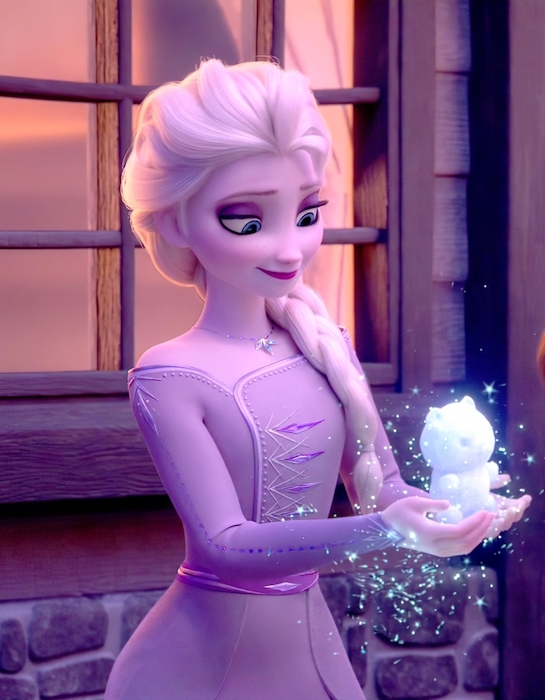 Elsa with an over the shoulder braid holding a small snow bear