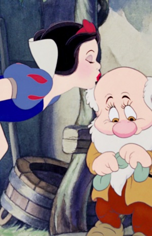 Snow White kisses Bashful on the top of his head