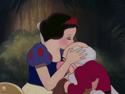 Snow White kisses to top of Grumpy's head