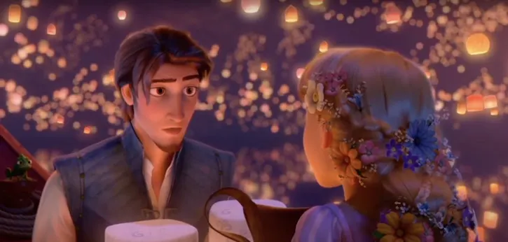 Flynn listening to Rapunzel on a boat surrounded by lanterns