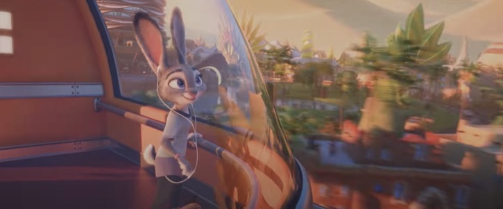 Judy riding the train to the city of Zootopia