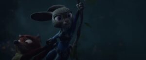 Judy swinging on a vine while holding on to Nick
