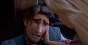 Rapunzel comforting Flynn after he is injured by Mother Gothel