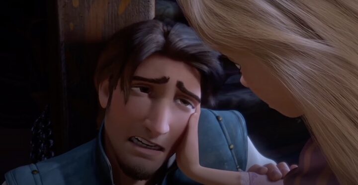 Rapunzel comforting Flynn after he is injured by Mother Gothel ...