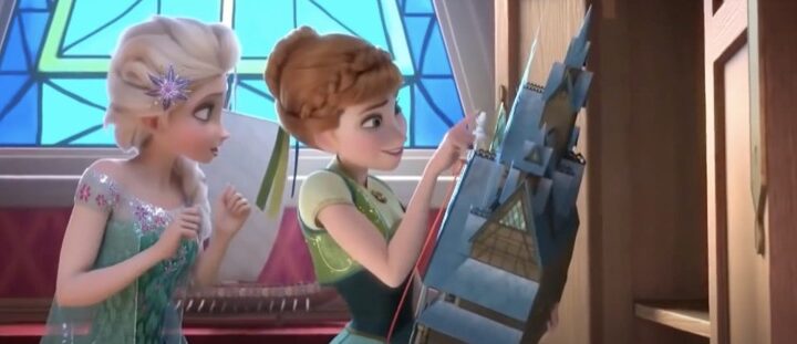 Elsa showing Anna a castle playhouse for her birthday