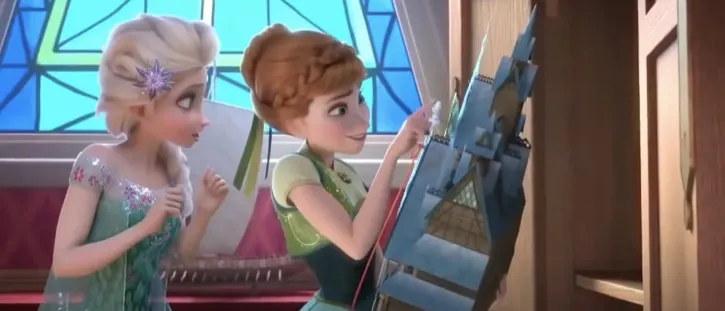 Elsa showing Anna a castle playhouse for her birthday