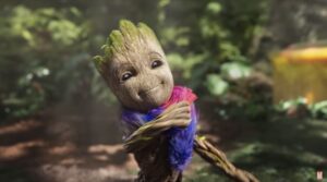 Groot wearing a pink and purple scarf