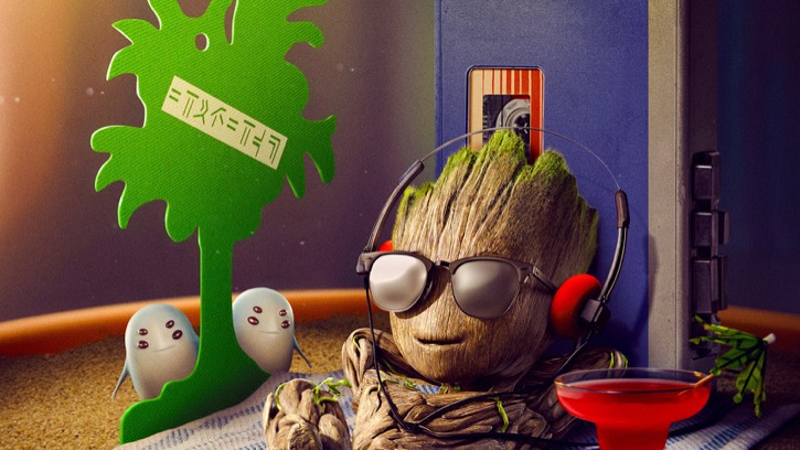 Young Groot laying back and listening to headphones