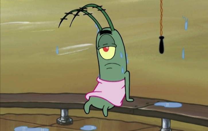 Plankton in a sauna wearing a pink towel
