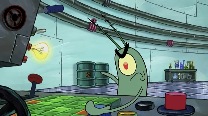 Plankton operating the control board at the Chum Bucket