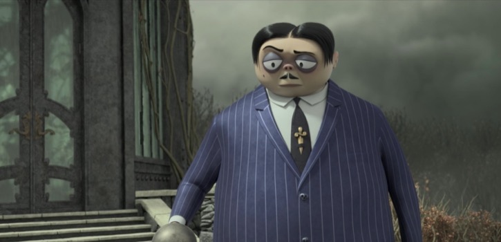 Gomez Addams wearing a suit