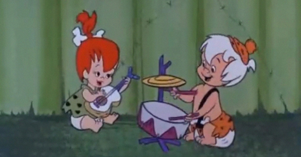 bamm bamm playing the drums and pebbles playing the guitar